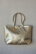Bolso shopping con cremallera dorado