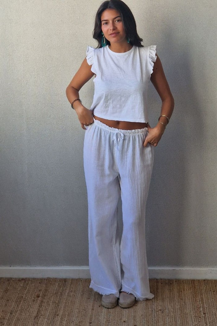 Pantalón tipo lino flecos blanco