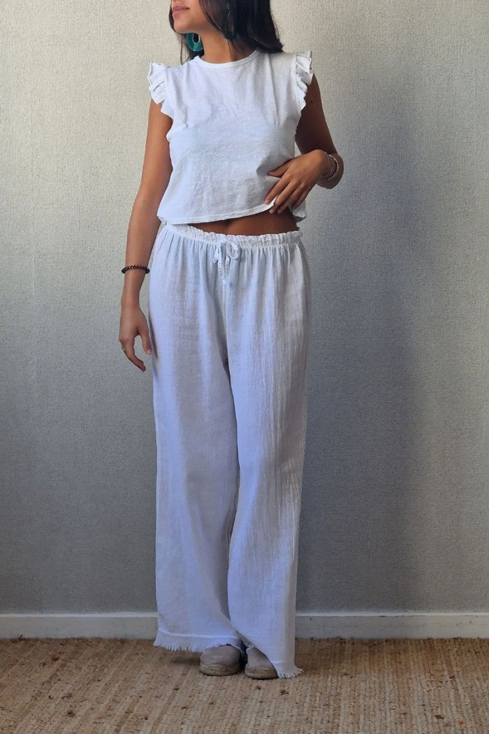 Pantalón tipo lino flecos blanco