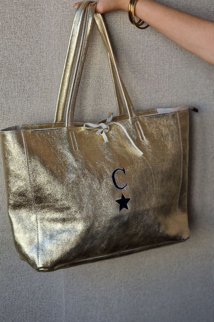 Bolso shopping con cremallera dorado