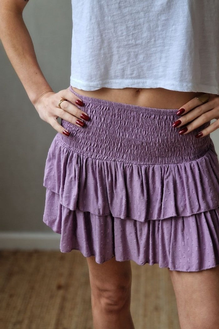 Minifalda pantalón lila con lurex cintura de goma y volantes