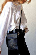 Bolso mini estrella tachuelas negro
