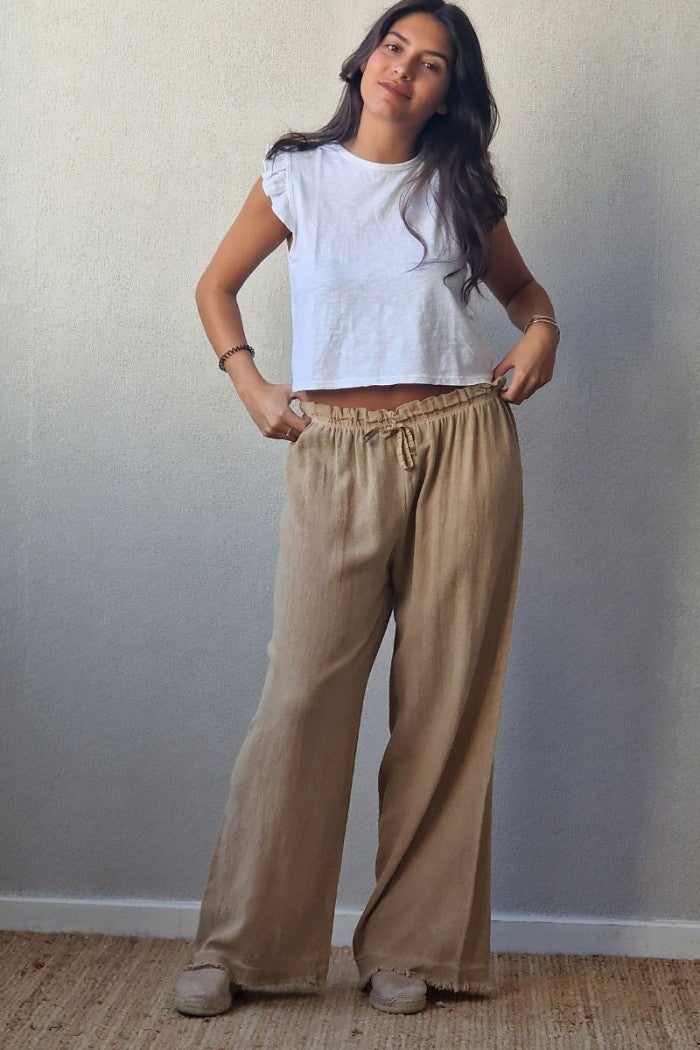 Pantalón tipo lino flecos camel