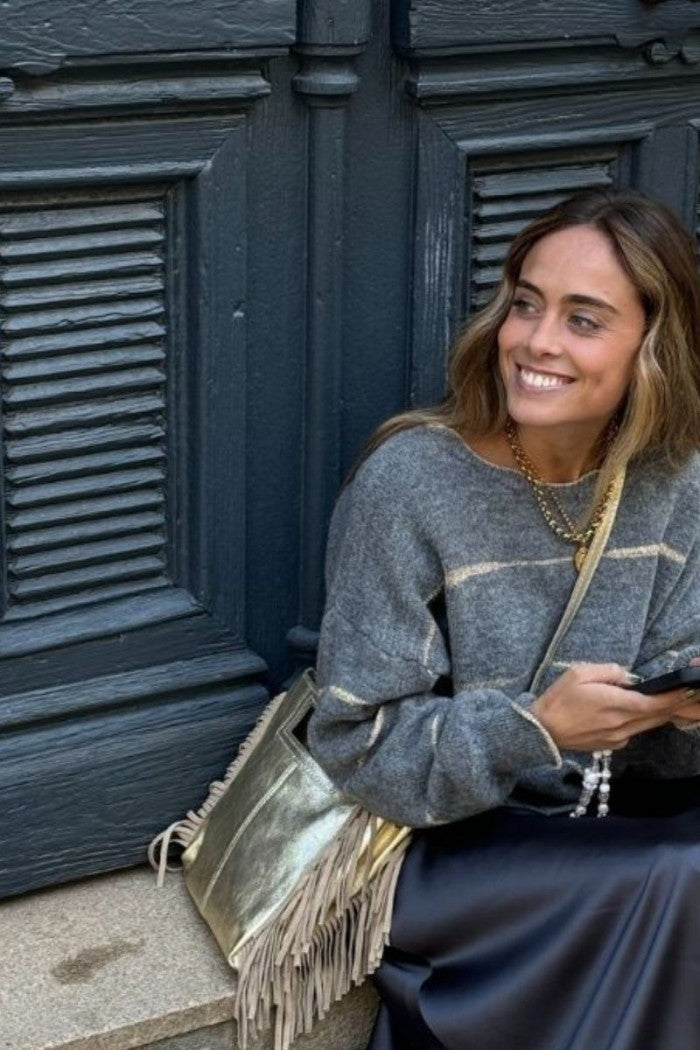 Bolso de piel con flecos dorado metalizado